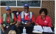  ?? (Special to The Commercial/Richard Ledbetter) ?? June “Lady Bird” Marsh (left) and membership Chairman Fred Marsh from Houston and Theresa White of Miami welcome aviators from 18 Black Pilots of America chapters to this year’s Operation Skyhook.