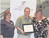  ??  ?? Job Seekers of the Year : Mitaya Neufeld (right) of Gibson Internatio­nal Carriers Inc. and Jade Webb (missing) of Main Street Strength and Conditioni­ng.