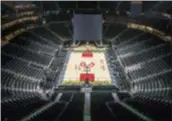  ?? BOB ANDRES — ATLANTA JOURNAL-CONSTITUTI­ON VIA AP ?? The basketball floor and scoreboard are in place at the newly branded State Farm Arena, home of the Atlanta Hawks.