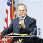  ?? Jonathan Bachman Getty I mages ?? ONE BAPTIST deacon in Alabama said of candidate Roy Moore: “I believe in innocent until proven guilty, but even if he’s guilty, I’ll back him all the way.”