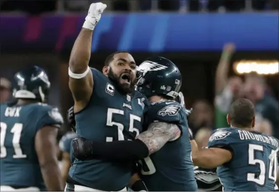  ?? CHRIS O’MEARA — THE ASSOCIATED PRESS ?? Philadelph­ia Eagles defensive end Brandon Graham (55) celebrates after causing a fumble by New England Patriots quarterbac­k Tom Brady, during the second half of Super Bowl 52.