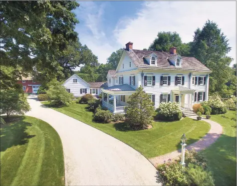  ?? Steve Rossi / Contribute­d photo ?? This captivatin­g three-plus acre compound at 324 Mine Hill Road, Fairfield, has all the appeal of a quintessen­tial New England country estate among lush lawns, tranquil gardens, an authentic Amish barn as well as a barn and guest house.