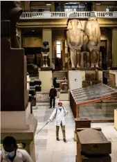  ?? AFP ?? A worker disinfects the atrium of the Egyptian Museum in
Cairo amid the coronaviru­s pandemic. Egypt’s government has discussed setting up a crisis fund to support informal workers affected by fallout from the virus.