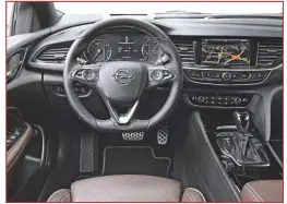  ??  ?? Opel voorziet de Insignia GSi van een sportstuur, aluminium pedalen en een headup display. Het touchscree­n kon groter.