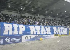  ??  ?? The travelling Rangers fans unveiled a banner in tribute to Ryan Baird, who died in a bus crash on the way to their previous match.