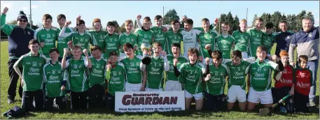  ??  ?? The triumphant Naomh Eanna squad with their mentors.