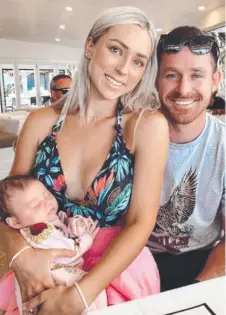  ??  ?? Michael Morgan (right) with wife Brianna and baby daughter Penelope. Picture: INSTAGRAM