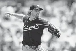  ?? JAYNE KAMIN-ONCEA USA TODAY NETWORK ?? Washington Nationals pitcher Jake Irvin throws to the plate in the third inning against the Los Angeles Dodgers at Dodger Stadium on Wednesday.