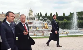  ?? EUROPEAN PRESS AGENCY ?? French President Emmanuel Macron (left) and Russian President Vladimir Putin met on Monday. Macron was critical of Russian media coverage of France’s presidenti­al election.