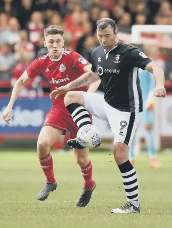  ??  ?? Jimmy Dunne (left), whilst on loan at Accrington Stanley.