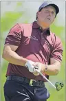  ?? "1 1)050 ?? Phil Mickelson watches his tee shot on the fifth hole during the second round of the Memorial golf tournament on June 2 in Dublin, Ohio.