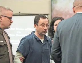  ?? MATTHEW DAE SMITH/LANSING STATE JOURNAL ?? Larry Nassar arrives in court Tuesday for the first day of victim impact statements.