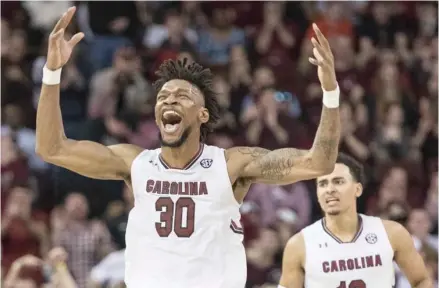  ?? Rayford, AP) (Photo by Sean ?? South Carolina forward Chris Silva (30) celebrates a score against Auburn during the first half of Saturday's game.