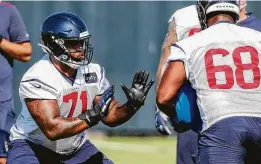  ??  ?? While quarterbac­k Deshaun Watson, top, points out what he wants done, rookie tackle Tytus Howard, left, runs a drill with guard Malcolm Pridgeon.