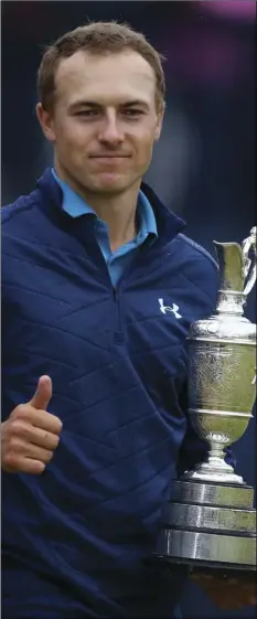  ?? AP PHOTO/DAVE THOMPSON ?? This July 23 file photo shows Jordan Spieth of the United States holding the trophy after winning the British Open Golf Championsh­ips at Royal Birkdale, Southport, England.