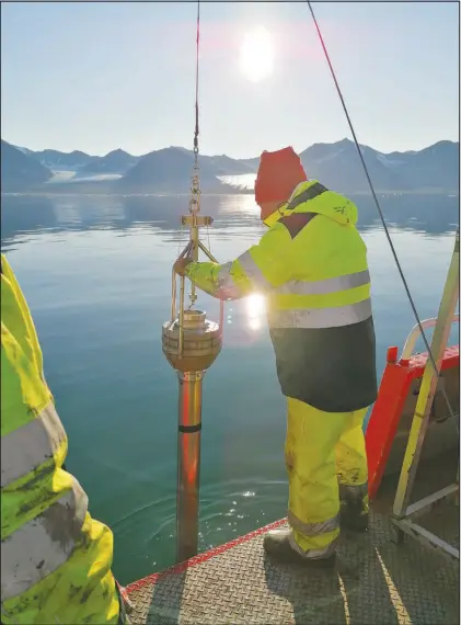  ?? SARA GIANSIRACU­SA VIA THE NEW YORK TIMES ?? Researcher­s extract a sediment core from the seaf loor of Kongsfjord­en, a fjord at the far eastern end of the Fram Strait between the Norwegian archipelag­o of Svalbard and Greenland. In a paper published in the journal Science Advances, researcher­s were able to turn back time with yard-long sediment cores taken from the seafloor finding that Atlantific­ation started at the beginning of the 20th century — decades before the process had been documented by satellite imagery.