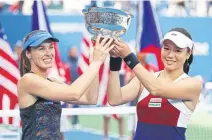  ?? AFP ?? Martina Hingis, left, and Chan Yung-Jan celebrate their win.