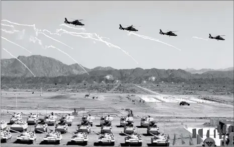  ??  ?? Helicopter­s and tanks perform at the opening ceremony of the Internatio­nal Army Games 2018 in Korla, Xinjiang Uyghur Autonomous Region on Sunday.