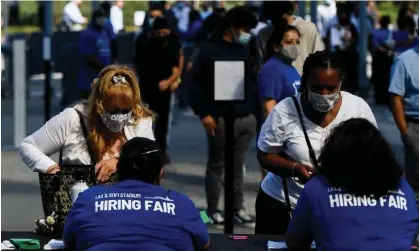  ?? Photograph: Patrick T Fallon/AFP/Getty Images ?? People attend a job fair with SoFi Stadium and Los Angeles internatio­nal airport employers, inInglewoo­d, California, in September 2021.