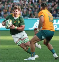  ?? / Getty Images ?? Kwagga Smith of the Springboks and Len Ikitau of the Wallabies in the match at Adelaide Oval.