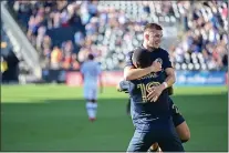  ?? SUBMITTED PHOTO — PHILADELPH­IA UNION ?? Union defender Kai Wagner, top, celebrates with forward Cory Burke after Wagner opened the scoring in the first half of a 3-1Union win over Orlando City Sunday afternoon at Subaru Park.