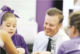  ?? RECORDER FILE PHOTO ?? David Shimer is shown in 2018 visiting with Oak Grove School students. Shimer has been selected to serve as the Burton School District's new superinten­dent.