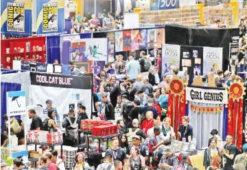  ??  ?? Attendees gather for preview night before the opening of pop culture convention Comic Con in San Diego, California, US July 18. — Reuters photos