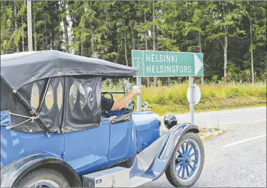  ??  ?? Australia’s most-travelled 1920 Dodge finds a signpost to Helsinki. Now the car, and author, will be making the trip to Dubbo. PHOTO: SUPPLIED