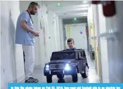  ??  ?? In this file photo taken on Feb 02, 2018, two-year-old Souhail sits in an electric toy car on his way to the operating room at the Valencienn­es Hospital. —AFP