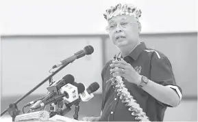 ?? — Gambar Bernama ?? PEMBUKA MAJLIS: Ismail Sabri berucap ketika merasmikan Mesyuarat Agung Tahunan POASM Kali Ke 23 Sesi 2021/2022 di Bera, semalam.