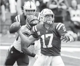  ?? MICHAEL CONROY AP ?? Colts quarterbac­k Philip Rivers looks to throw against the Cincinnati defense. The Bengals led 21-0, but Rivers brought Indianapol­is back.