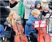  ??  ?? In tune Our Lady’s Primary pupils Elise Nichol and Danny Urquhart