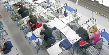  ?? — Reuters ?? Women work on sewing machines at the Fashion Enter factory in London England.