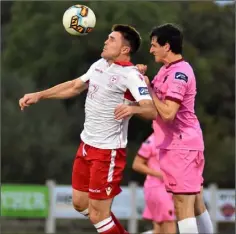  ??  ?? Davy O’Sullivan of Shelbourne is challenged by Paddy Cahill.