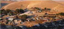  ?? - Reuters file ?? SLATED FOR DEMOLITION: A general view shows the main part of the Palestinia­n Bedouin encampment of Khan Al Ahmar village that Israel plans to demolish, in the occupied West Bank.