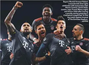  ??  ?? Bayern Munich forward Robert Lewandowsk­i (2nd right) celebrates with teammates Xabi Alonso (centre), David Alaba (centre, top), Franck Ribery (right) and Arturo Vidal after scoring a penalty during yesterday’s Champions League last 16 2nd leg match...