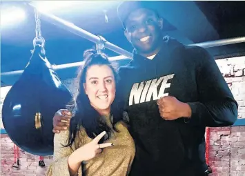  ??  ?? Pictured is Anne-Marie Neckles, joint owner of BOx boxing studio in Loughborou­gh, with Dillian Whyte, British WBC Internatio­nal heavyweigh­t title holder.