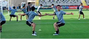  ?? AFP ?? Japan’s captain Maya yoshida (right) attends a training session on the eve of their group f match against Turkmenist­an. —