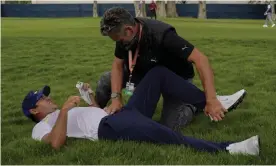  ?? Photograph: Jeff Chiu/AP ?? Brooks Koepka is treated for a hip injury on the 12th hole during the second round of the PGA Championsh­ip golf tournament at TPC Harding Park in San Francisco.