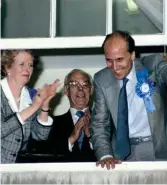  ??  ?? Norman Tebbit, right, with Margaret and Denis Thatcher looking out from Conservati­ve Central Office, Smith Square, after winning the 1987 election