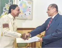  ?? PTI ?? KCR submits his government’s recommenda­tion for dissolving the assembly and his resignatio­n to ESL Narsimhan in Hyderabad. —