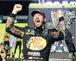  ?? TERRY RENNA/THE ASSOCIATED PRESS ?? Martin Truex Jr. celebrates in Victory Lane on Sunday after winning at Homestead-Miami Speedway and winning the season championsh­ip in Homestead, Fla.