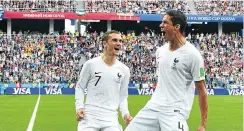  ?? Picture: AFP ?? France defender Raphael Varane, right, celebrates with Antoine Griezmann after scoring the opener against Uruguay at the Nizhny Novgorod Stadium on Friday.