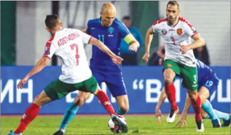  ??  ?? NO DUTCH COURAGE . . . Netherland­s captain Arjen Robben (second left) tries to work his way past Bulgaria’s Georgi Kostadinov (left) during their 2018 FIFA World Cup qualificat­ion football match in Sofia on Saturday night. — AFP