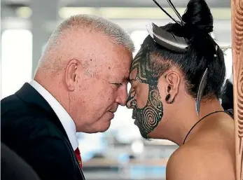  ?? GETTY IMAGES ?? Lions coach Warrren Gatland recieves a hongi on arrival at Auckland Airport.