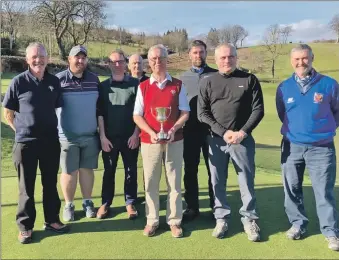  ?? ?? The winning Whiting Bay team with captain Stan Rainey holding the Duncan Trophy.