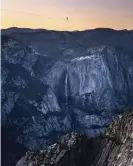  ?? Oller/Associated Press ?? Highliner Daniel Monterrubi­o walks the 2,800-foot line off Taft Point in Yosemite national park on 12 June. Photograph: Scott