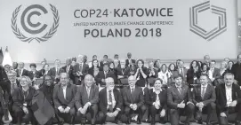  ?? KAROLINA JONDERKO NYT ?? A group portrait at the United Nations Climate Change Conference in Katowice, Poland, on Saturday. Diplomats from nearly 200 countries reached a deal on Saturday.