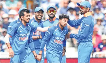  ??  ?? India’s Kuldeep Yadav (2nd R) celebrates wicket of England’s Jonny Bairstow with teammates during first ODI at Trent Bridge on Thursday.