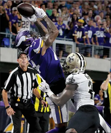 ?? AP/BRUCE KLUCKHOHN ?? Minnesota Vikings wide receiver Stefon Diggs catches a 2-yard touchdown pass over New Orleans Saints cornerback De’Vante Harris during the first half of Monday night’s game in Minneapoli­s. Diggs had two scoring receptions out of quarterbac­k Sam...